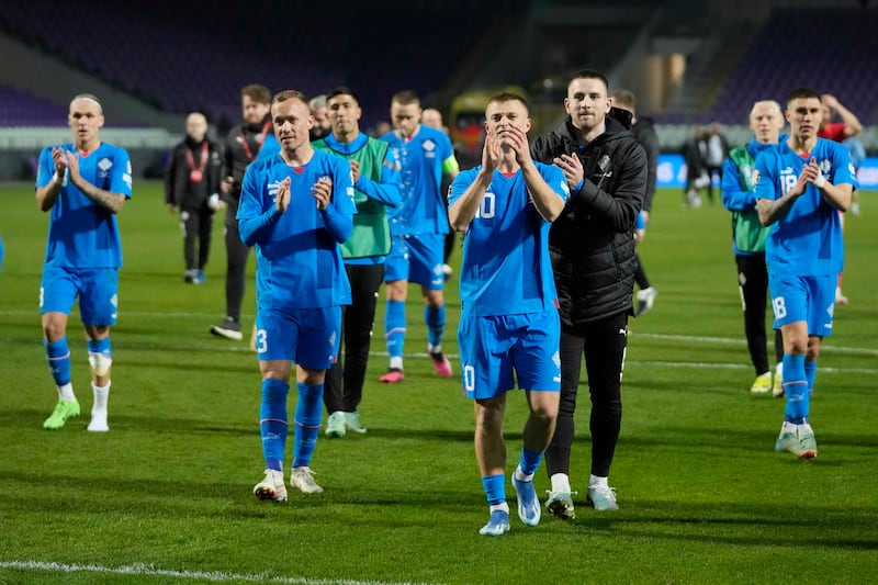 Iceland players applaud their fans after the 4-1 win against Israel in Budapest. AP