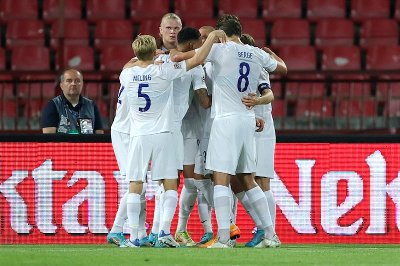 Erling Haaland of Norway celebrates with teammates after scoring against Serbia. Getty Images