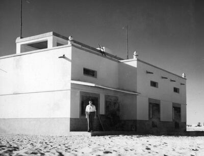 The house in Abu Dhabi where the first Anglican Christian service was held in December 1957. Standing in front is Tim Hillyard, head of offshore oil exploration, who lived there with his wife Susan. Photo: BP Archives