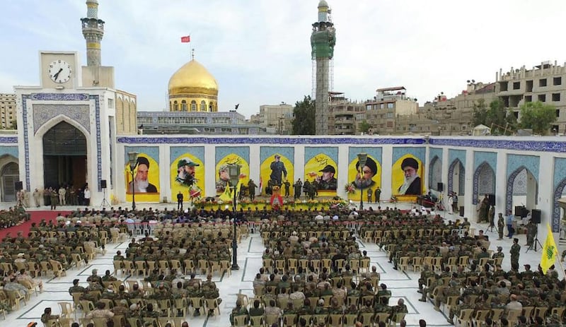 Hizbollah supporters attend a memorial ceremony on Tuesday at the Sitt Zeinab Shiite Shrine in Damascus for slain commander Mustafa Badreddine, who was killed in Syria last week. AFP 