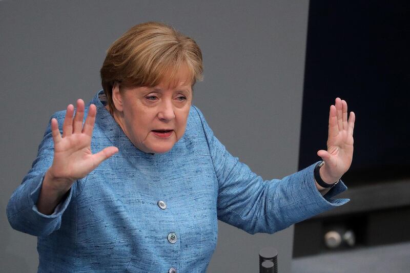 Angela Merkel, Germany's chancellor, gestures while speaking during a budget policy plan debate in the lower-house of the Bundestag in Berlin, Germany, on Wednesday, May 16, 2018. Merkel said governments must step up efforts to integrate the euro area because the European Central Bank’s expansive monetary policy won’t last forever. Photographer: Krisztian Bocsi/Bloomberg