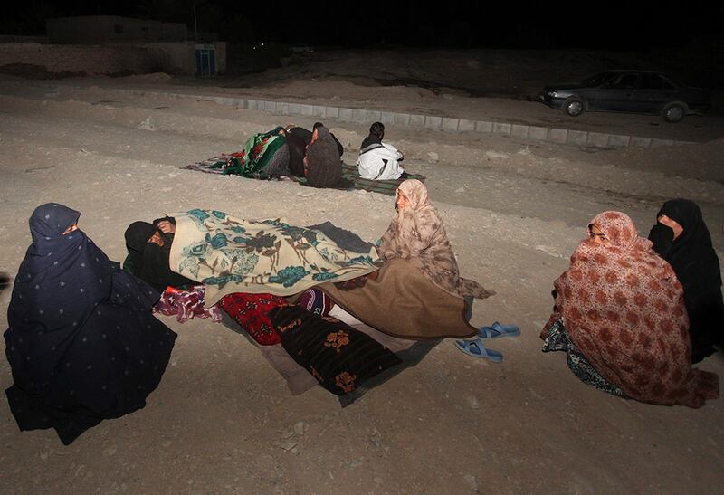 In this photo taken Tuesday, April 16, 2013, Iranians stay outside their homes at the Gosht district after an earthquake hit southeastern Iran. The earthquake toppled homes and shops on both sides of the Iran-Pakistan border Tuesday, killing dozens of people and causing skyscrapers to sway in Dubai. It also forced Iranian officials - for the second time in less than a week - to issue assurances that its main nuclear reactor wasn't damaged. (AP Photo/Mehr News Agency, Hamid Sadeghi) *** Local Caption ***  Mideast Iran Earthquake.JPEG-0cb1b.jpg