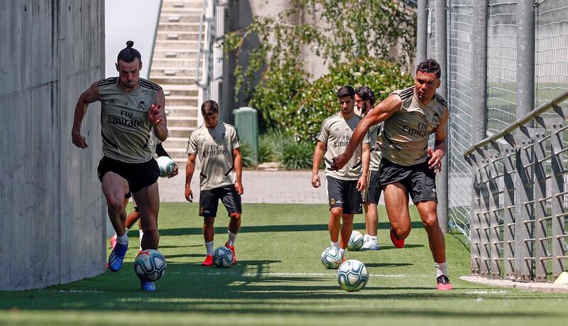 MADRID, SPAIN - MAY 22: (L-R) Gareth Bale and Casemiro of Real Madrid kick the ball during the team's training session amid Covid-19 pandemic at Valdebebas training ground on May 22, 2020 in Madrid, Spain. (Photo by Antonio Villalba/Real Madrid via Getty Images)