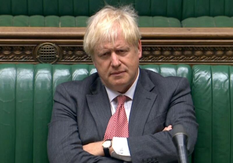 A video grab from footage broadcast by the UK Parliament's Parliamentary Recording Unit (PRU) shows Britain's Prime Minister Boris Johnson listening as Britain's main opposition Labour Party Shadow Business, Energy and Industrial Strategy Secretary Ed Miliband (unseen) speaks in the debate into the Government's proposed Internal Markets Bill, in the House of Commons in London on September 14, 2020. - Prime Minister Boris Johnson was set to face down critics on Monday to argue in favour of a new law that his government openly admits will break its EU divorce treaty, as wrangling over Brexit returns to the British parliament. Furious officials in Brussels have demanded the proposed legislation is withdrawn before the end of the month, and Johnson is facing threats of rebellion and resignations. (Photo by - / PRU / AFP) / RESTRICTED TO EDITORIAL USE - MANDATORY CREDIT " AFP PHOTO / PRU " - NO USE FOR ENTERTAINMENT, SATIRICAL, MARKETING OR ADVERTISING CAMPAIGNS