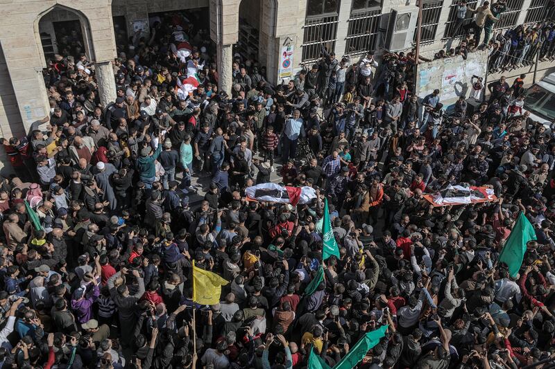 Palestinians attend the funeral of members of the Abu Raiya family, who were killed in a fire at an apartment in the Jabalia refugee camp in the Gaza Strip. EPA 