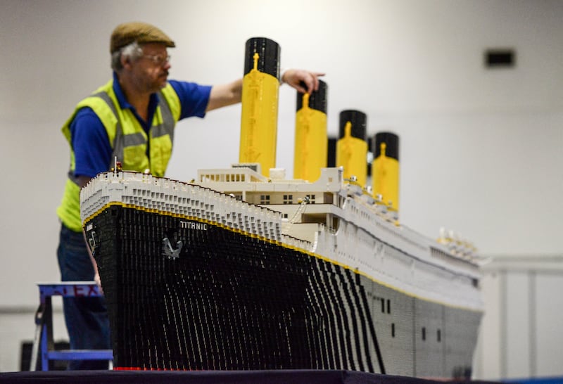 Lego builder Phil Traviss puts the finishing touches to his Titanic, made from 120,000 bricks over a period of three months at ExCel in London, 2015. Getty Images