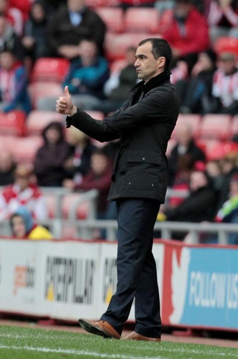 Everton's Spanish manager Roberto Martinez gestures from the touchline during an English Premier League football match. Everton visit Southampton on Saturday and Martinez will be short of players. AFP PHOTO/LINDSEY PARNABY