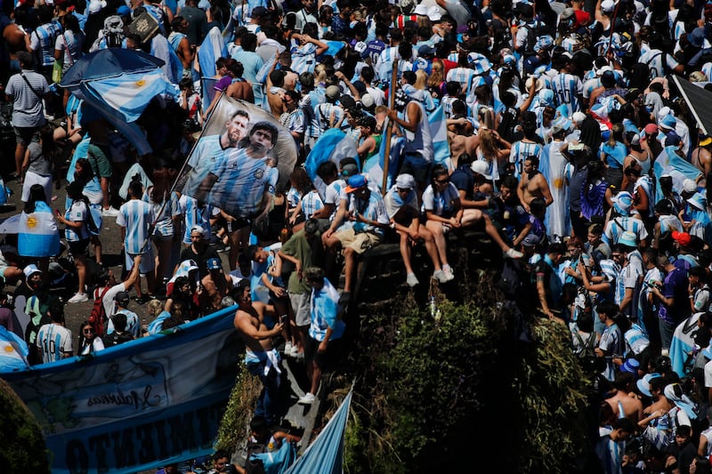 Argentina fans wait to greet their World Cup heroes in the victory parade in Buenos Aires. Reuters