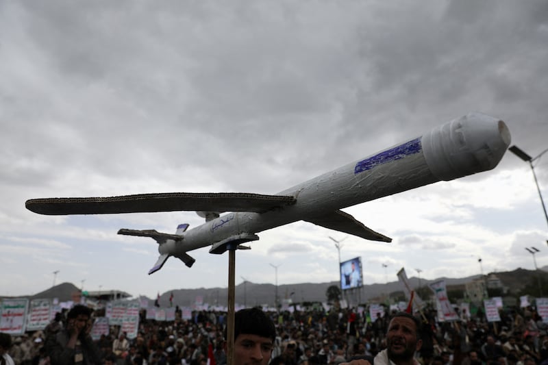 A protester carries a mock drone as Houthi supporters rally to show support to Palestinians in the Gaza Strip. Reuters