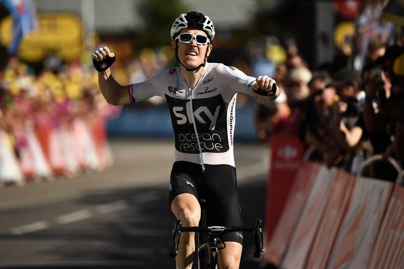 Great Britain's Geraint Thomas celebrates as he crosses the finish line to win the eleventh stage of the 105th edition of the Tour de France cycling race between Albertville and La Rosiere, French Alps, on July 18, 2018. / AFP / Marco BERTORELLO
