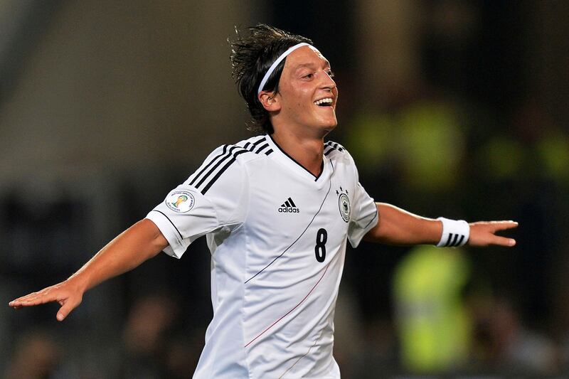 Mesut Ozil, after scoring for Germany during their World Cup-winning campaign in Brazil in 2014, announced his retirement from football on Wednesday, March 22, 2023. AP