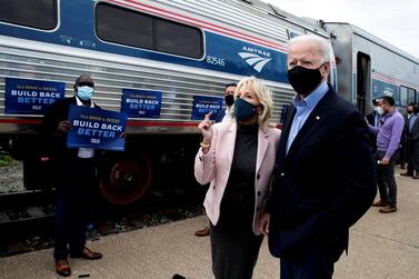 Joe Biden, the president-elect and his wife, Jill, on the campaign trail in Cleveland, Ohio, prior to Mr Biden's election victory. Reuters