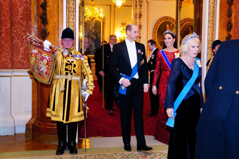 The Prince and Princess of Wales arrive at the reception behind Queen Consort Camilla. PA