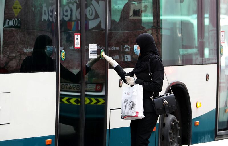 ABU DHABI, UNITED ARAB EMIRATES , June 1 – 2020 :- A woman wearing protective face mask as a preventive measure against the spread of coronavirus at the bus stop in Abu Dhabi. UAE government lifts the coronavirus restriction for the residents and businesses around the country. (Pawan Singh / The National) For News/Stock