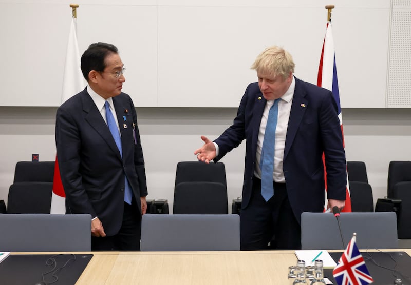 Japanese Prime Minister Fumio Kishida and Boris Johnson attend a bilateral meeting. Getty Images