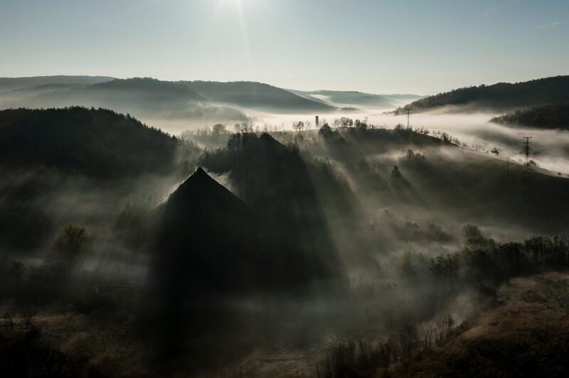 Slag waste mounds from a former thermal power plant peek from a blanket of fog near Salgotarjan, Hungary. EPA 