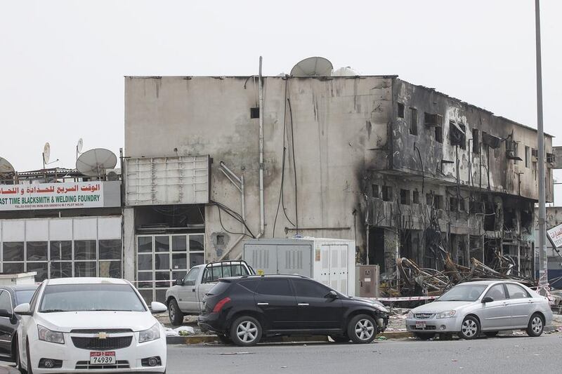 Expatriate mechanics, technicians and helpers who work in the industrial area attributed the fire to an electrical short circuit within the building in Musaffah Industrial Area-7. Mona Al Marzooqi/ The National