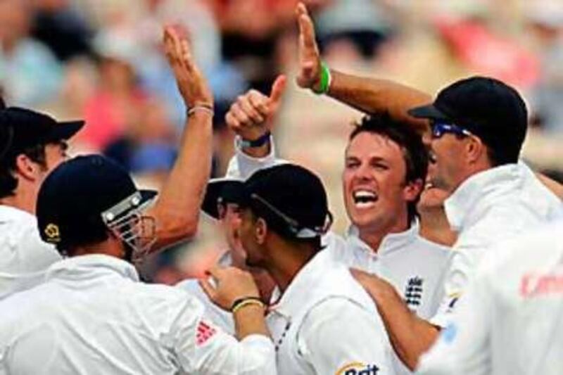 England's Graeme Swann, second from right, celebrates with his teammates after dismissing Bangladesh's Shakib Al Hasan on Saturday.