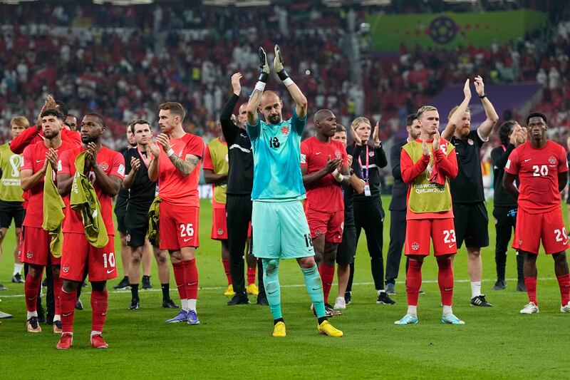Canada goalkeeper Milan Borjan and his team applaud their fans after elimination. AP