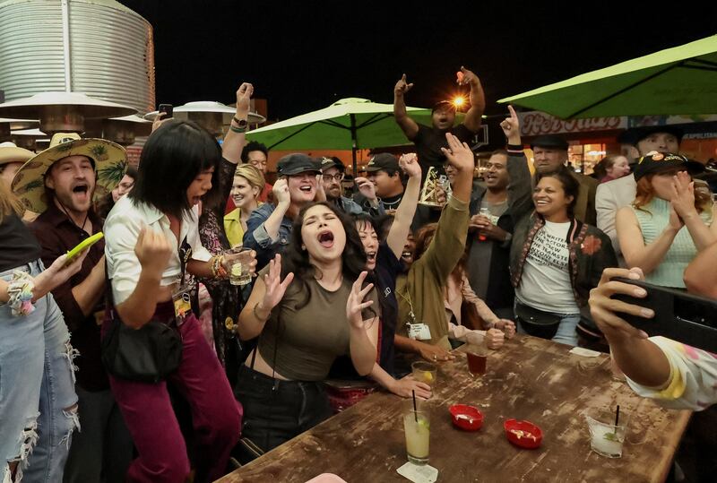 Sag-Aftra members celebrate after a deal was reached between the actors' union and Hollywood studios. Reuters