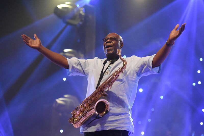 (FILES) In this file photo taken on June 29, 2018 Cameroon jazz saxophonist Manu Dibango performs during a concert at the Ivory Hotel in Abidjan. Veteran Cameroon jazz star Dibango dies after contracting coronavirus, said his entourage en March 24, 2020. / AFP / Sia KAMBOU
