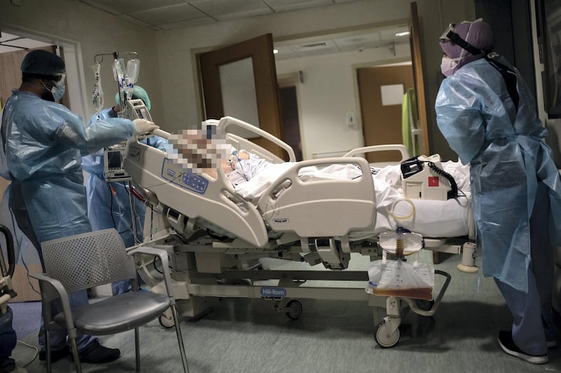 [NOTE TO EDITORS: The face of the patient has been blurred to protect identity] ©2021 Tom Nicholson. 18/01/2021. Beirut, Lebanon. A patient is moved in the Coronavirus Emergency Room (ER) at the American University of Beirut (AUB) Hospital. Deaths from Coronavirus in Lebanon reached a peak high of 53 today. Photo credit : Tom Nicholson