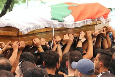 The burial of Rami Salman, one of two aides of Lebanese minister Saleh Al Gharib killed on Sunday in an alleged assassination attempt. Mohamed Azakir / Reuters