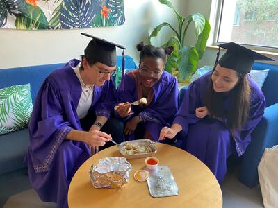 ABU DHABI, UNITED ARAB EMIRATES. 27 MAY 2020. 
Munib Mesinovic, Vongai Christine Mlambo, and Daria Zahaleanu have dimsums with friends via an online chat room, before their graduation commences from NYU AD today.

(Photo: Reem Mohammed/The National)

Reporter:
Section:
