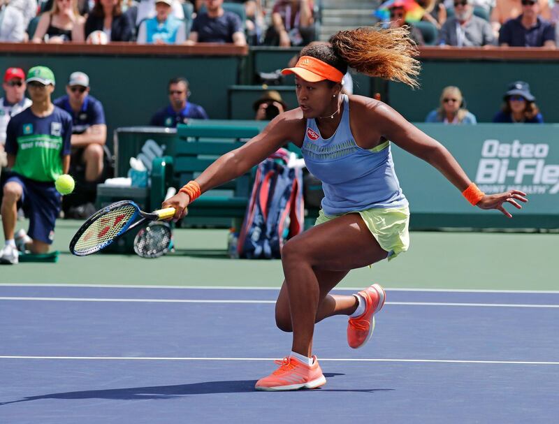 epa06613226 Naomi Osaka of Japan in action against Daria Kasatkina of Russia during the BNP Paribas Open at the Indian Wells Tennis Garden in Indian Wells, California, USA, 18 March 2018.  EPA/JOHN G. MABANGLO