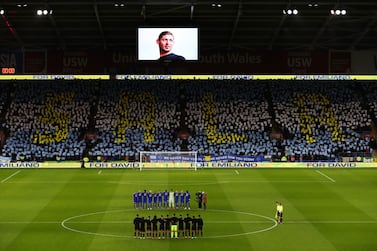 Players, fans and officials take part in a minute of silence in tribute to Emiliano Sala and pilot David Ibbotson, whose flight disappeared over the English Channel last month. Getty