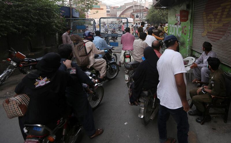 A street sealed by the authorities at an area restricted to help contain the spread of coronavirus, in Lahore, Pakistan. EPA