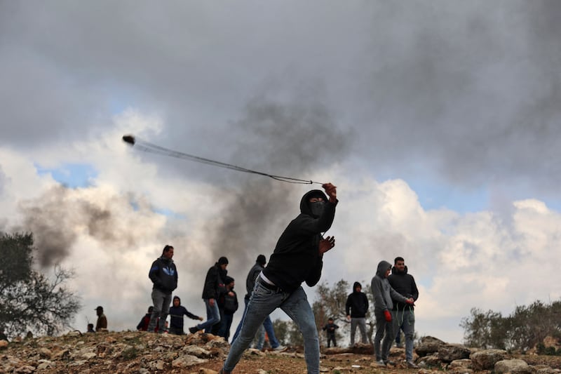 Palestinian protesters gather during clashes with Israeli security forces following a demonstration against settlements in the village of Beita in the occupied West Bank. AFP