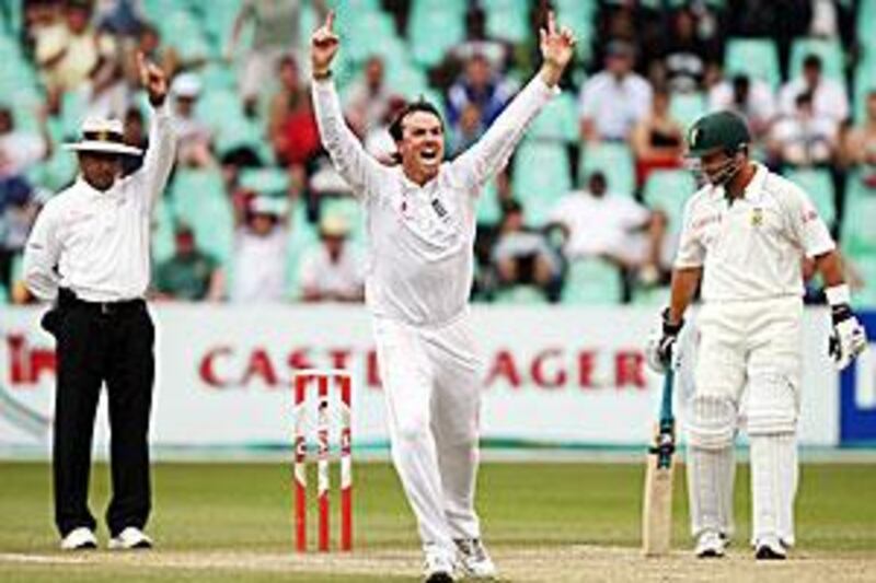 A delighted Graeme Swann of England takes the wicket of South Africa captain Graeme Smith at Kingsmead Stadium yesterday.