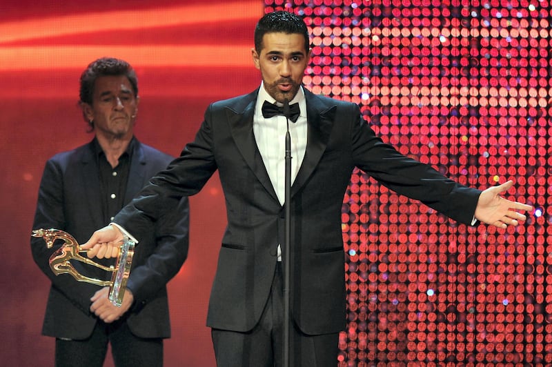 WIESBADEN, GERMANY - NOVEMBER 10:  Bushido receives the Integration award from Peter Maffay during the Bambi Award 2011 show at the Rhein-Main-Hallen on November 10, 2011 in Wiesbaden, Germany.  (Photo by Christian Augustin/Getty Images)
