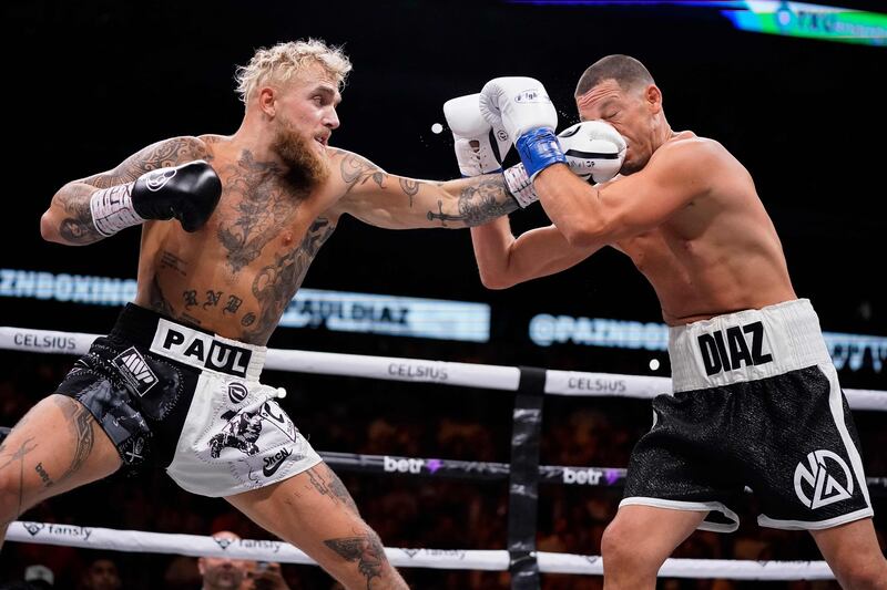 DALLAS, TEXAS - AUGUST 05: Jake Paul throws a left at Nate Diaz during the first round of their fight at the American Airlines Center on August 05, 2023 in Dallas, Texas.    Sam Hodde / Getty Images / AFP (Photo by Sam Hodde  /  GETTY IMAGES NORTH AMERICA  /  Getty Images via AFP)