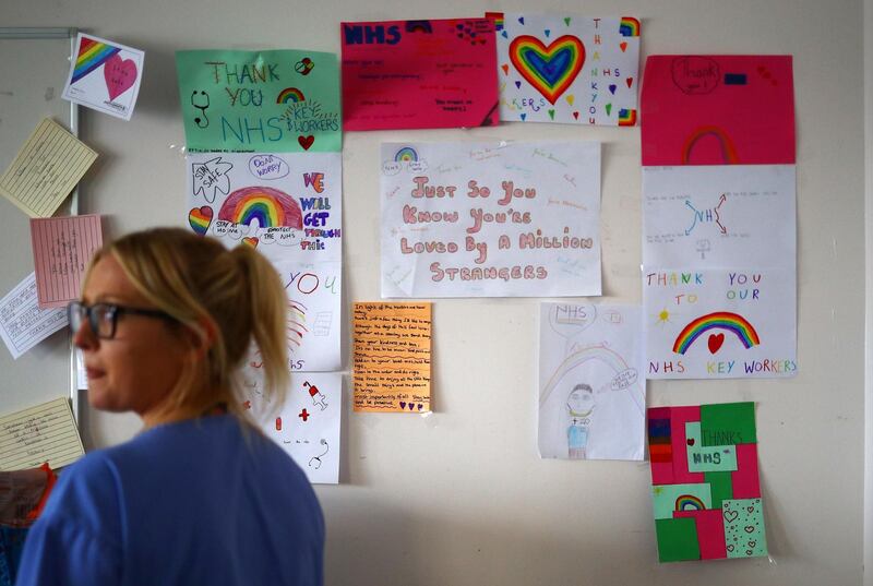 Thank you notes and rainbow pictures on the wall of a staff room at the Royal Blackburn Teaching Hospital in Blackburn, north-west England, May 14.  Hannah Mckay/ AFP / Pool
