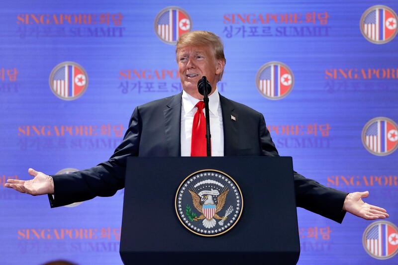 FILE - In this June 12, 2018, file photo, U.S. President Donald Trump answers questions about the summit with North Korea leader Kim Jong Un during a press conference at the Capella resort on Sentosa Island in Singapore. To South Koreans, Bob Woodward's new book about the Trump presidency paints a bizarre but familiar picture of an unconventional U.S. leader who thinks little of a decades-long alliance that South Koreans describe as a "bond of blood." (AP Photo/Evan Vucci, File)