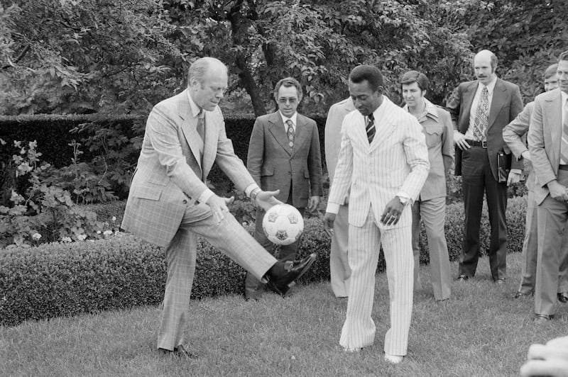 Brazilian football star Pele toured the White House and ended up in the Rose Garden giving President Ford a football lesson. Getty Images
