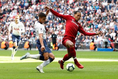 Soccer Football - Premier League - Tottenham Hotspur v Liverpool - Wembley Stadium, London, Britain - September 15, 2018  Tottenham's Erik Lamela in action with Liverpool's Virgil van Dijk   Action Images via Reuters/Paul Childs  EDITORIAL USE ONLY. No use with unauthorized audio, video, data, fixture lists, club/league logos or "live" services. Online in-match use limited to 75 images, no video emulation. No use in betting, games or single club/league/player publications.  Please contact your account representative for further details.