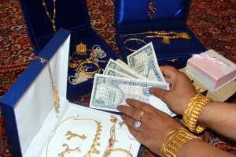 OMAN, OCTOBER 1, 2009: Mother of the groom handing over the dowry to the bride's family in a special ceremony. Ali Saleh for The National