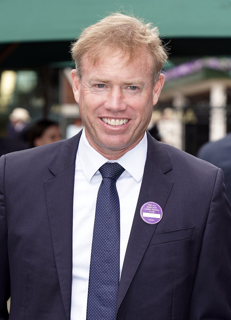 Former tennis pro Mark Petchey was all smiles as he arrived. PA