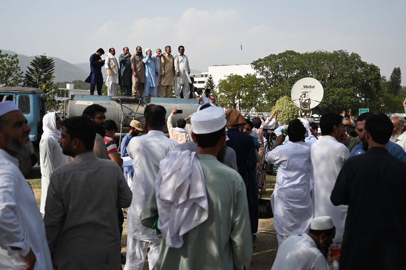 Workers protest in front of the parliament in Islamabad during the annual budget session, demanding an increase in salaries. AFP