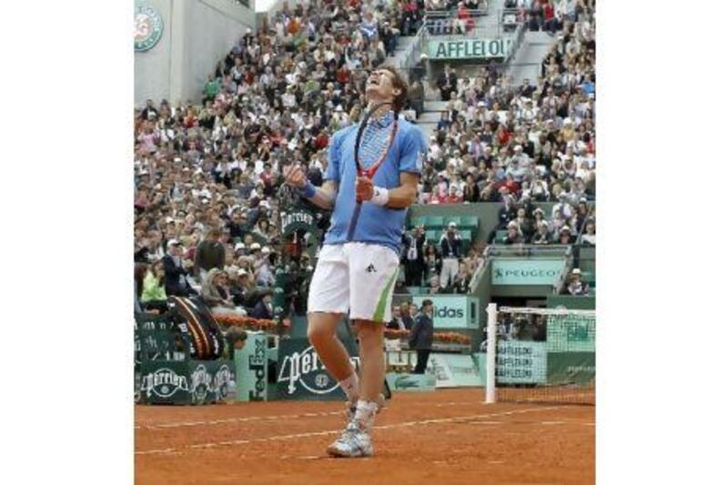 Andy Murray exhults in pleasure after nursing his injured right ankle throughout his defeat of Serbia's Viktor Troicki in their quarter-final match at the French Open yesterday. Next up for Murray is Juan Ignacio Chela.