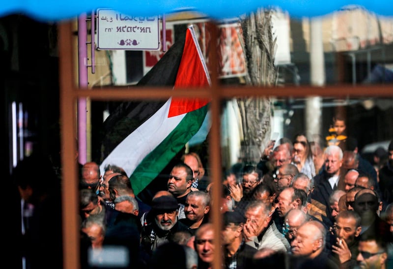 Arab Israelis wave Palestinian flags as they take part in a rally to express their opposition to the US-brokered proposal for a settlement of the Israeli-Palestinian Middle East conflict, in the Arab-Israeli town of Baqa al-Gharbiya in northern Israel.   AFP