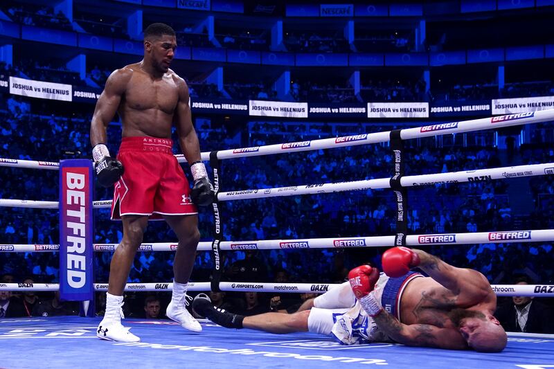 Antony Joshua knocks out Robert Helenius in the seventh round of their heavyweight boxing fight at London's O2 Arena. PA