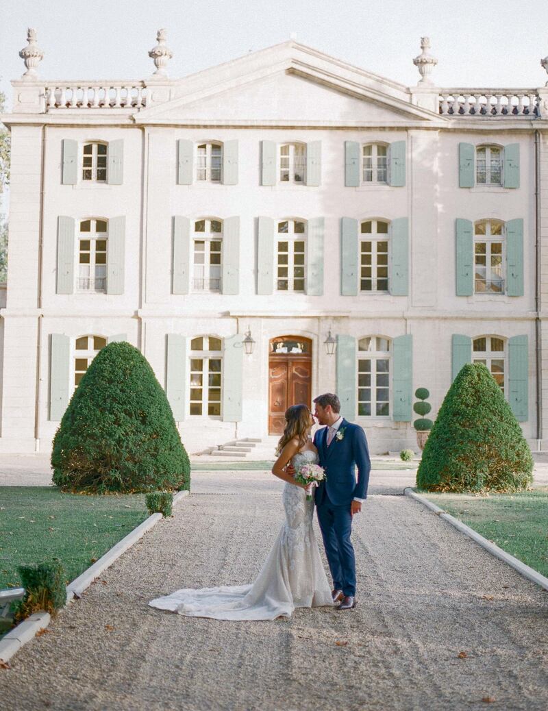 A happy bride and groom following their chateau wedding. Courtesy Gert Huygaerts via Chateau De Tourreau