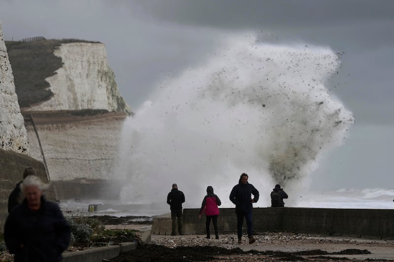 Waves crash into the harbour wall in Newhaven, southern England. AP