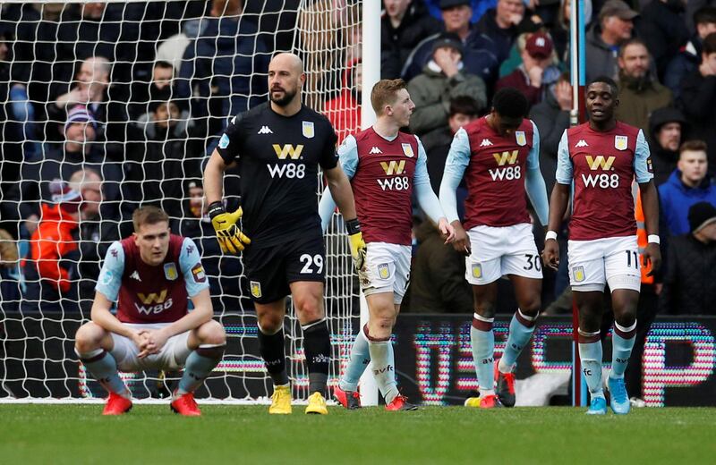 Dejected Aston Villa players after the late winner. Reuters