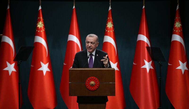 Turkish President Recep Tayyip Erdogan makes a speech as he holds a press conference following the cabinet meeting at the Presidential Complex in Ankara, on February 1, 2021.  President Recep Tayyip Erdogan said on February 1 it may be time for Turkey to adopt a new constitution, feeding speculation that he could seek a way to extend his rule. / AFP / Adem ALTAN
