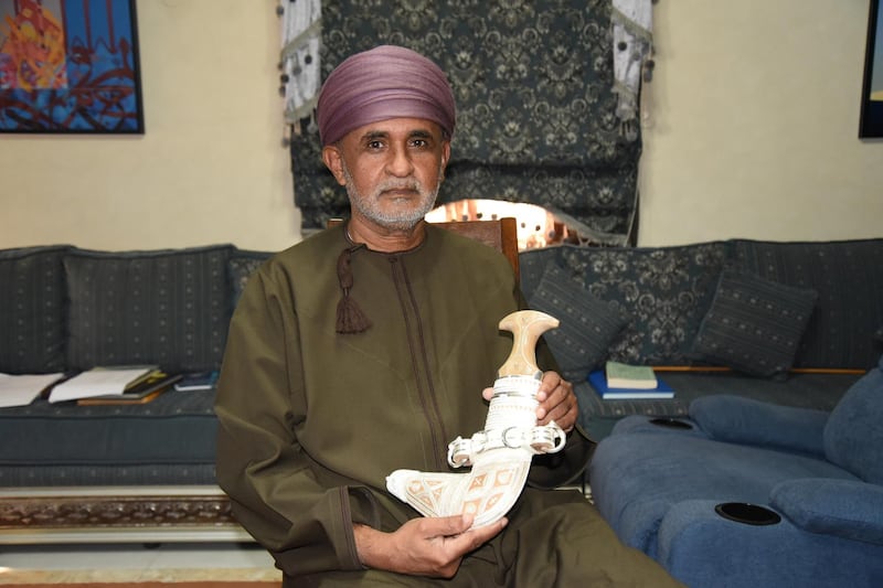 Mohammed Al Sayegh holding up one of his khanjar: A master craftsman from the coastal city of Sur, near Oman’s eastern tip, Al Sayegh is the scion of a family that has been making khanjar for more than 100 years. Photo: Ismael David Mujahid